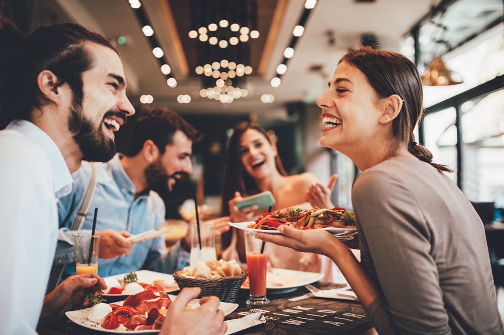 People enjoying a meal together at a restaurant